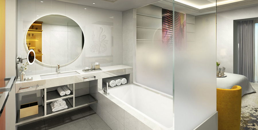 White bathroom with glass walls accompanied with marble wash basins and bathtub. hba HBA &#8211; The Best Interior Design Projects in Dubai HBA6